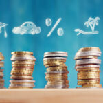 Piggy bank with stacked coins on blue background