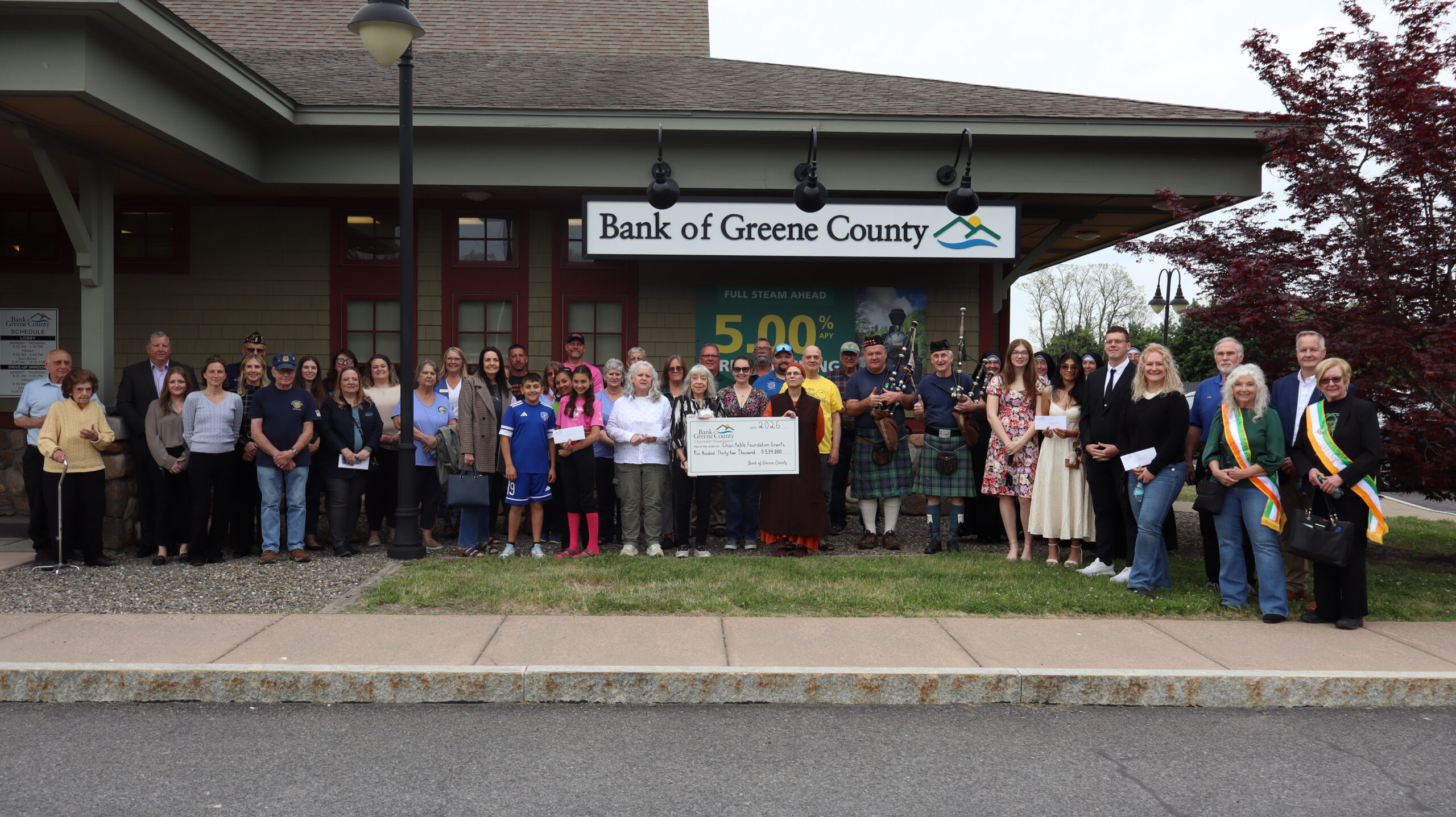 Cairo branch charitable ceremony group picture with big check