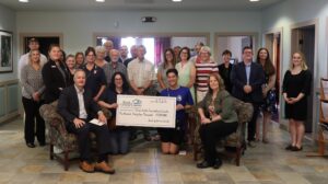 Coxsackie branch charitable ceremony group picture with big check
