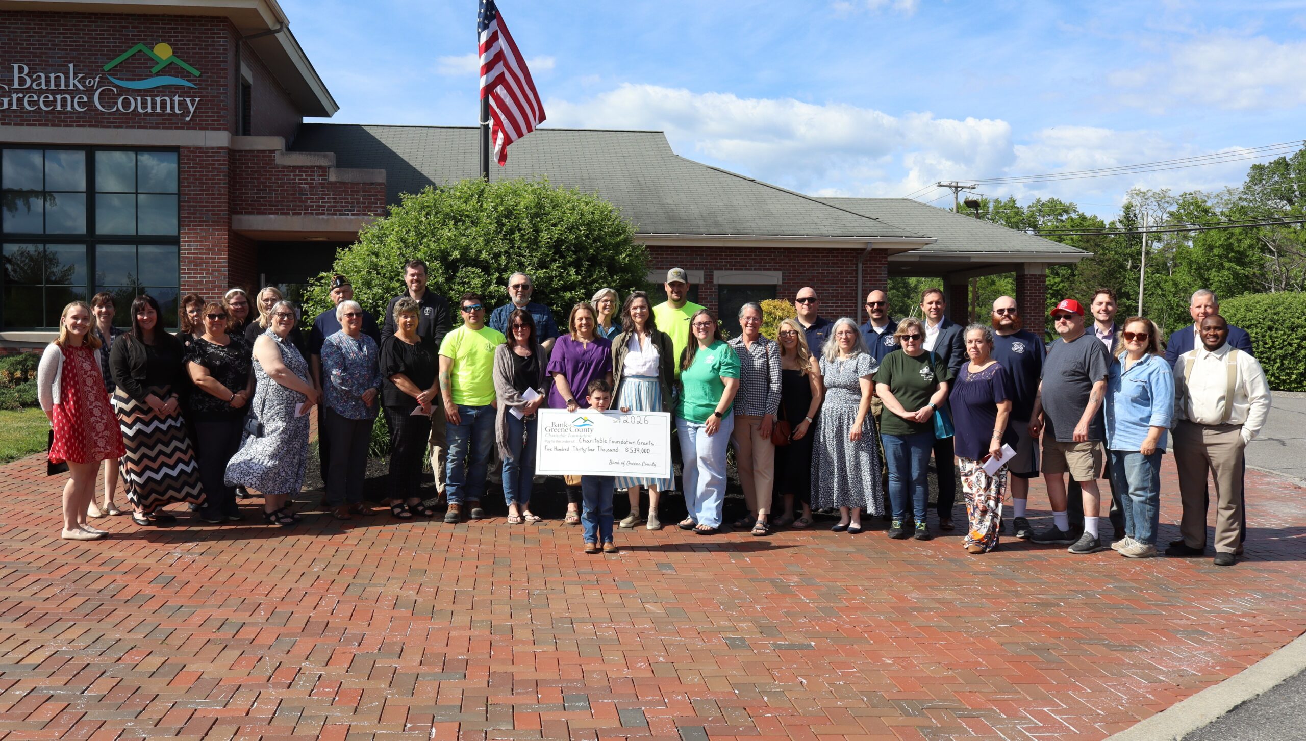 Greenville branch charitable ceremony group picture with big check