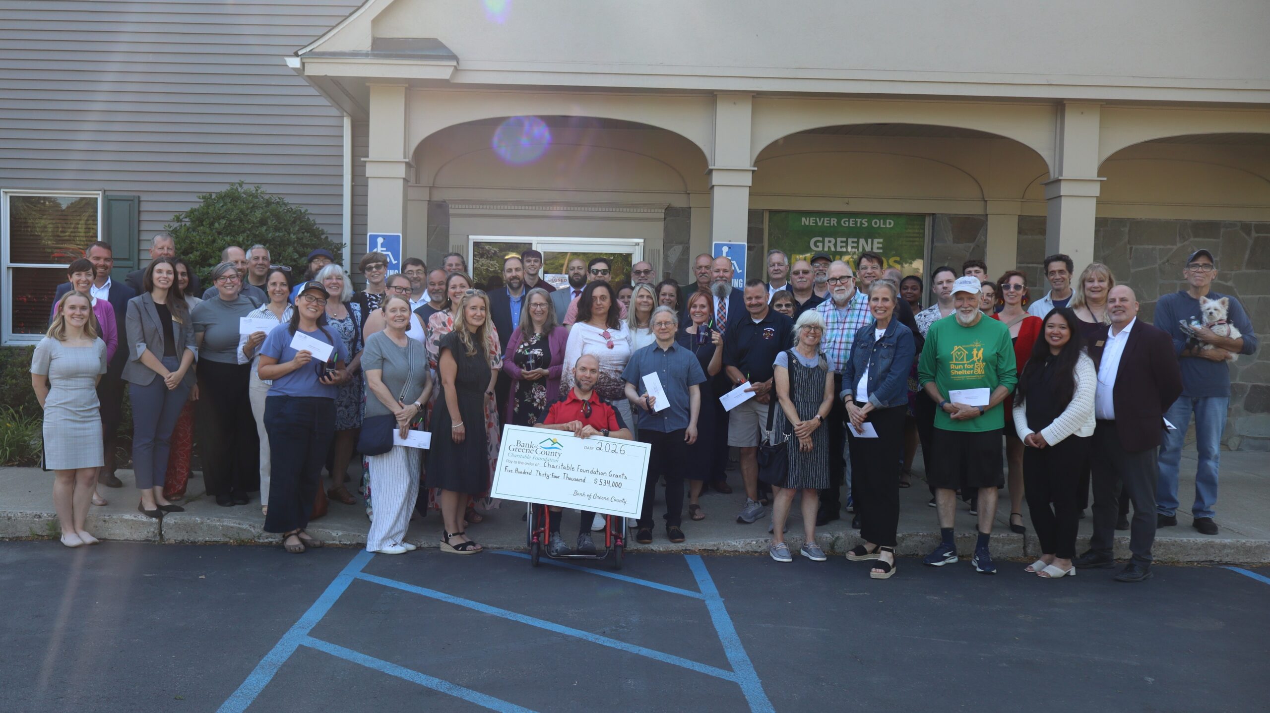 Ravena branch charitable ceremony group picture with big check