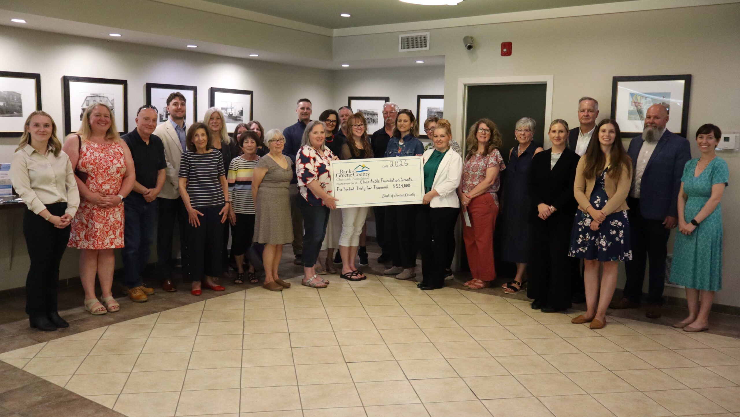 Ravena branch charitable ceremony group picture with big check