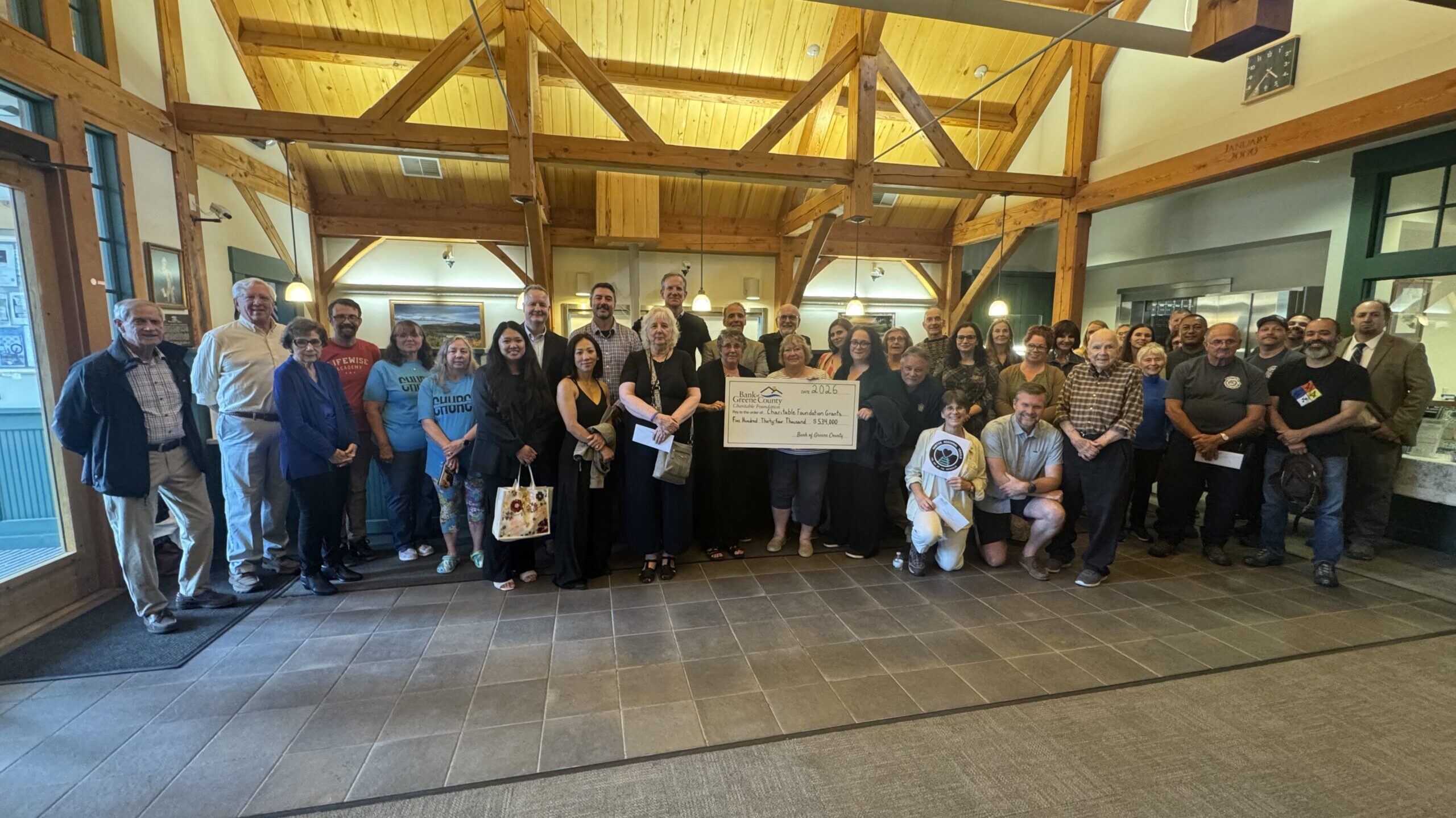 Tannersville branch charitable ceremony group picture with big check