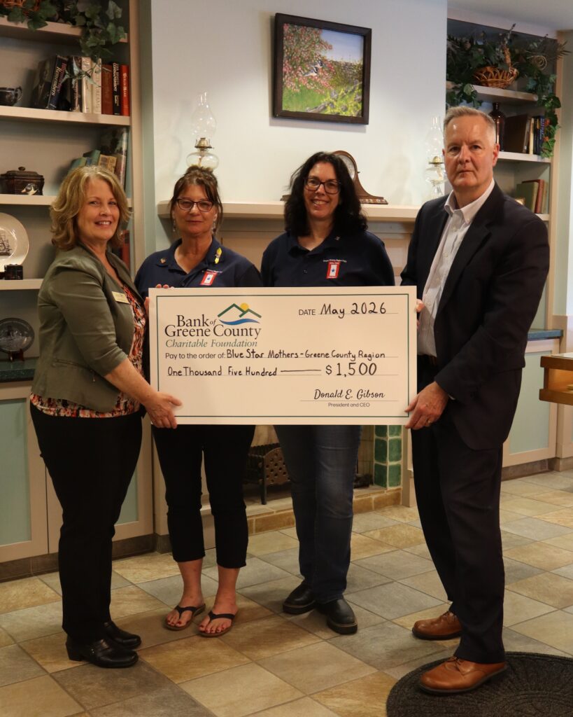 Bank President, Don Gibson presents big check to blue star mothers representatives in Coxsackie branch.