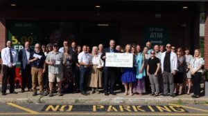 Clifton Park branch charitable ceremony group picture with big check