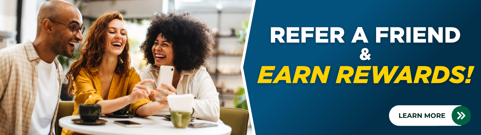 friends looking at phone and laughing. Refer a friend & Earn Rewards! Click to learn more.